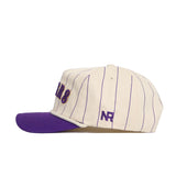 The No Rivals LSU Walk Off Hat features cream cotton fabric with thin purple pinstripes, a purple brim, and purple NR embroidery on the side. This unstructured cap is shown in a side profile on a white background.