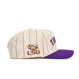 The No Rivals LSU Walk Off Hat is a cream cotton snapback with purple pinstripes, a purple bill, an embroidered LSU logo with tiger face on the side, and partially visible "TIGERS" text on the front. Unstructured fit for comfort.