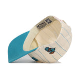 The Coastal Carolina Walk Off Hat by No Rivals, when flipped upside down, features a light blue brim, cream cotton fabric with thin blue stripes, cartoon embroidery on the side, and an interior label that reads NO RIVALS.
