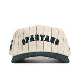 The No Rivals Michigan State Walk Off Hat is a cream cotton snapback with thin black pinstripes, green SPARTANS embroidery on the front, an adjustable design, and a dark green brim. Shown from the front view.
