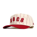 The Arkansas Walk Off Hat by No Rivals features a cream color with red vertical pinstripes, a red brim, and raised red HOGS lettering. This unstructured, adjustable cotton cap delivers comfort and style for any fan.