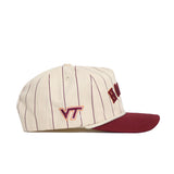 The No Rivals Virginia Tech Walk Off Hat is a cream baseball cap with thin maroon stripes, a maroon brim, and the VT logo in maroon and orange. Made from cotton with an unstructured fit and a snap back closure. Front lettering is partially visible.