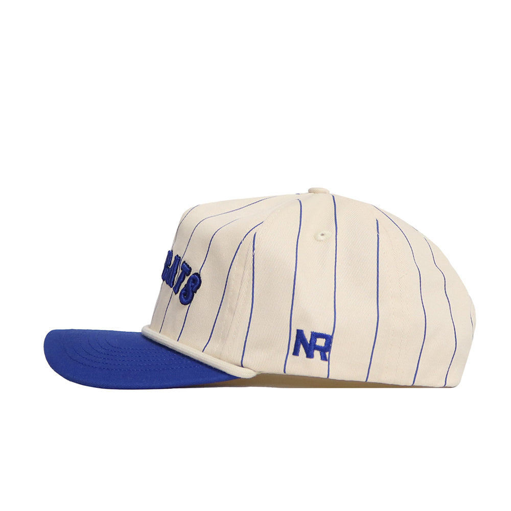The No Rivals Kentucky Walk Off Hat is a cream, unstructured cotton cap with blue pinstripes, a blue brim, "NR" embroidered on the side, partially visible blue text on the front, and an adjustable fit for comfort and style.