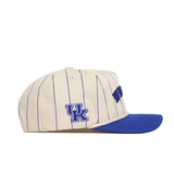The No Rivals Kentucky Walk Off Hat features a cream color, unstructured fit, blue pinstripes and bill, plus the University of Kentucky UK logo embroidered in blue on the side.