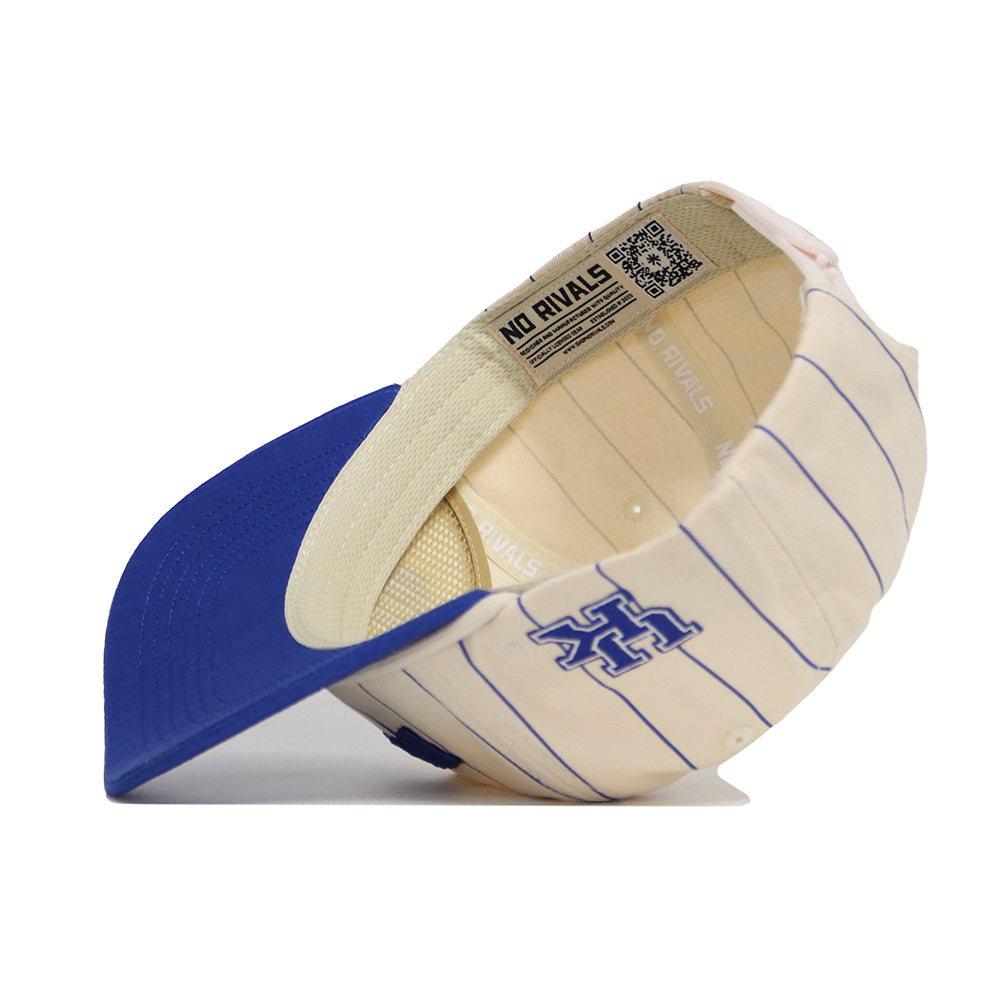The Kentucky Walk Off Hat by No Rivals is a cream cotton adjustable cap with blue pinstripes, a blue brim, and a blue embroidered logo. The unstructured fit features "NO RIVALS" text along the inside band.