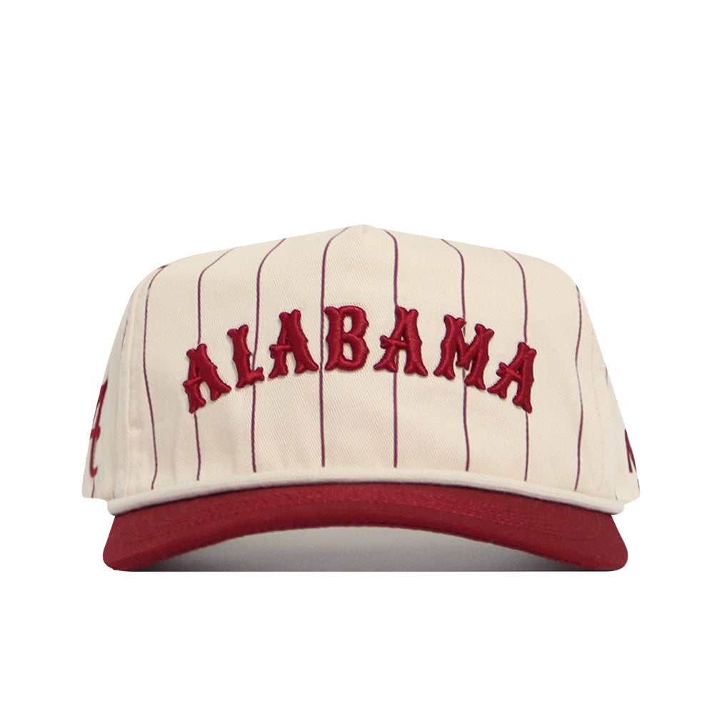 The No Rivals Alabama Walk Off Hat is a cream snapback with thin red stripes, ALABAMA embroidered in bold red on the front, a solid red brim, and an unstructured high-quality cotton fit.