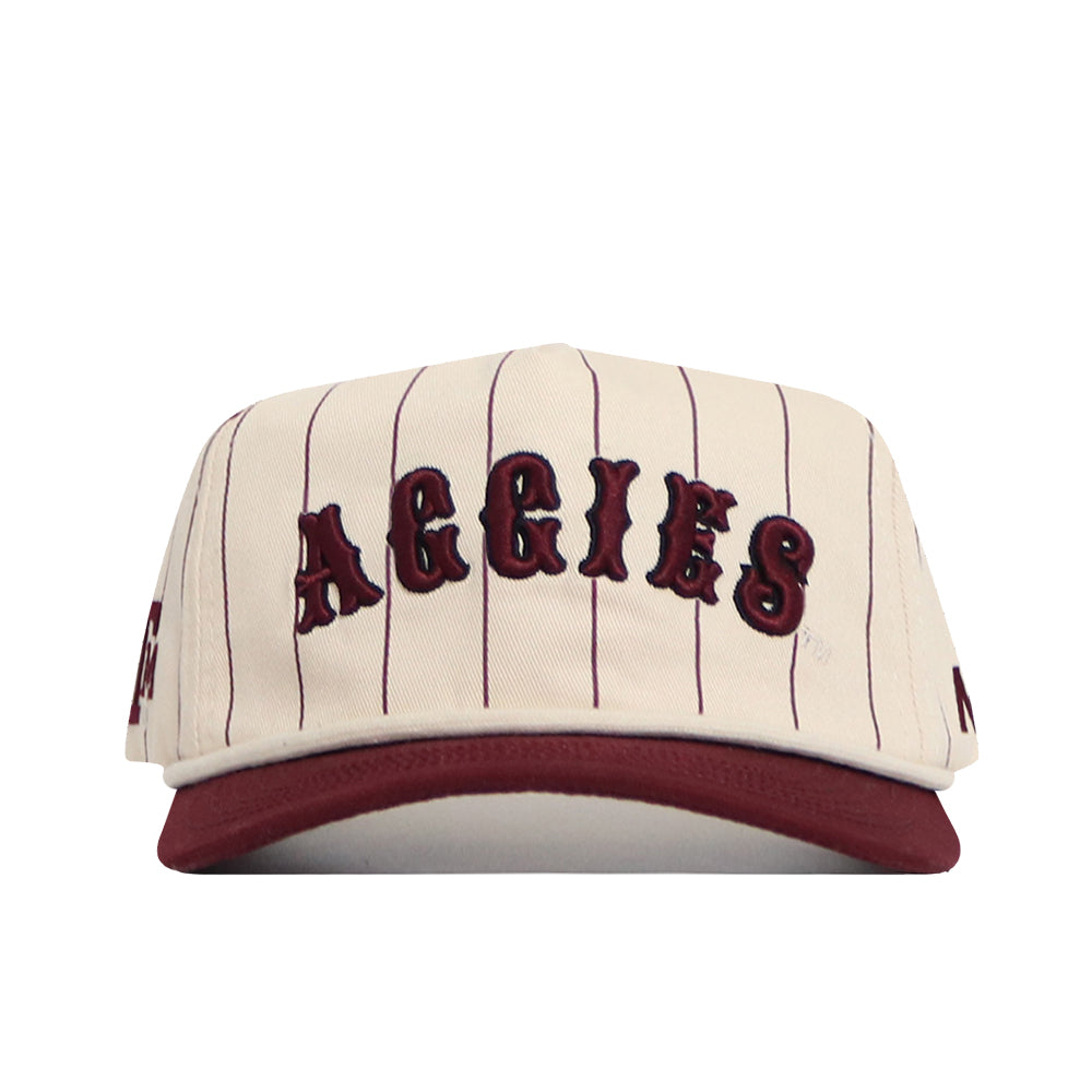 The No Rivals Texas A&M Walk Off Hat is a cream snapback with thin maroon stripes, bold AGGIES lettering, a maroon brim, high-quality cotton fabric, and an unstructured fit for comfort.