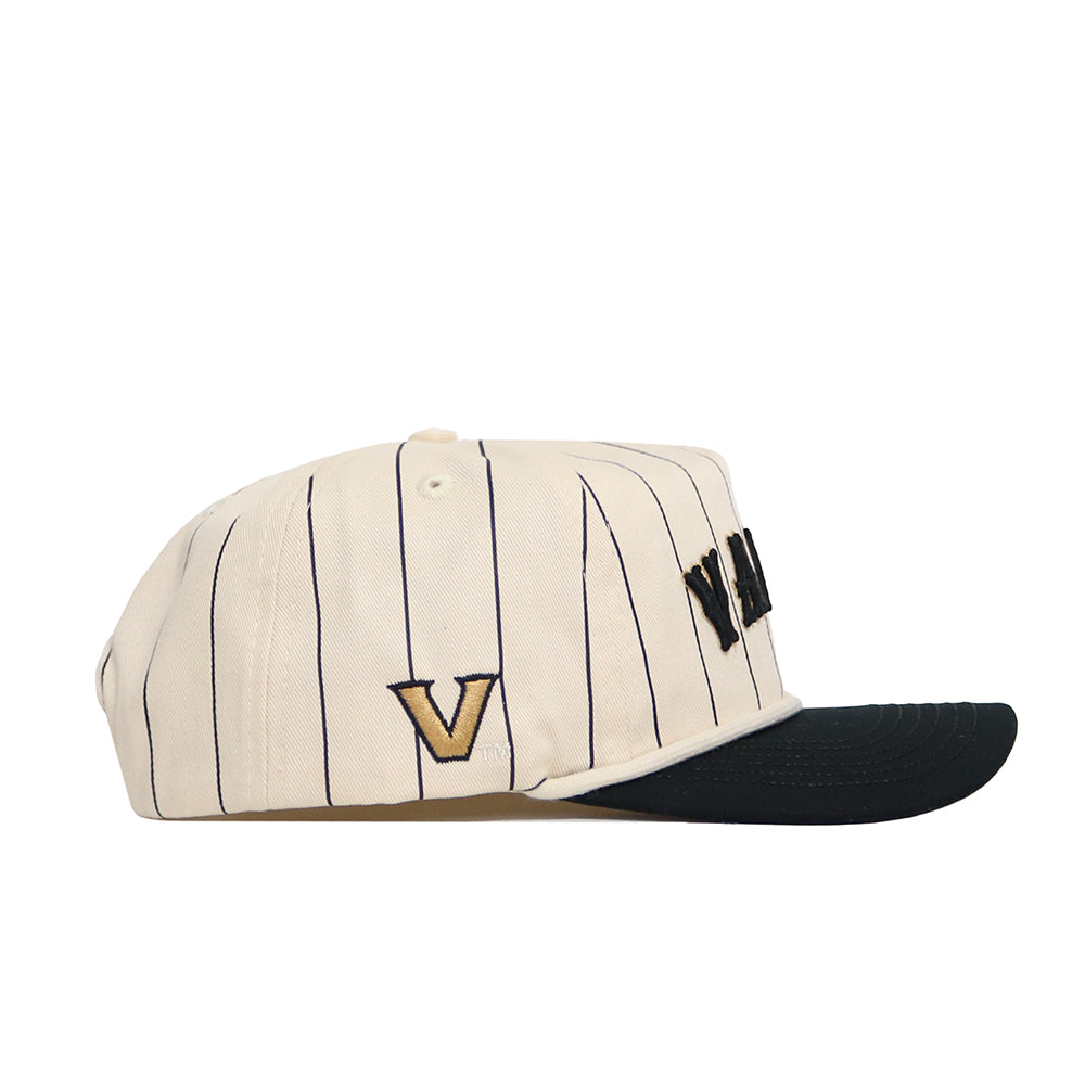 The No Rivals Vanderbilt Walk Off Hat features a cream color with thin black stripes, a black visor, and an embroidered gold and black V on the side.