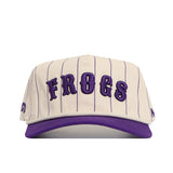 The No Rivals TCU Walk Off Hat features a cream snapback design with purple vertical pinstripes, soft cotton fabric, bold raised "FROGS" lettering on the front, matching purple brim, and an unstructured fit for comfort.