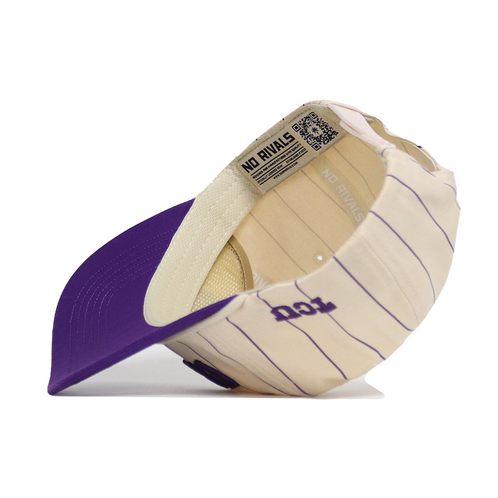 The TCU Walk Off Hat by No Rivals is shown upside down, displaying its beige and purple design with vertical purple pinstripes, a solid purple brim, an unstructured fit, and a NO RIVALS label inside.