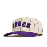 The TCU Walk Off Hat by No Rivals features a cream snapback design with thin purple pinstripes, bold purple 3D "FROGS" on the front, a purple brim, and comfortable cotton fabric for an easy unstructured fit.