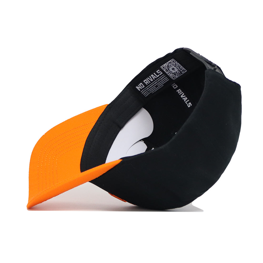 The Tennessee Tailgate Hat by No Rivals is a black and orange structured cotton snapback, shown on its side to display NO RIVALS on the sweatband and a QR code on the inner lining.