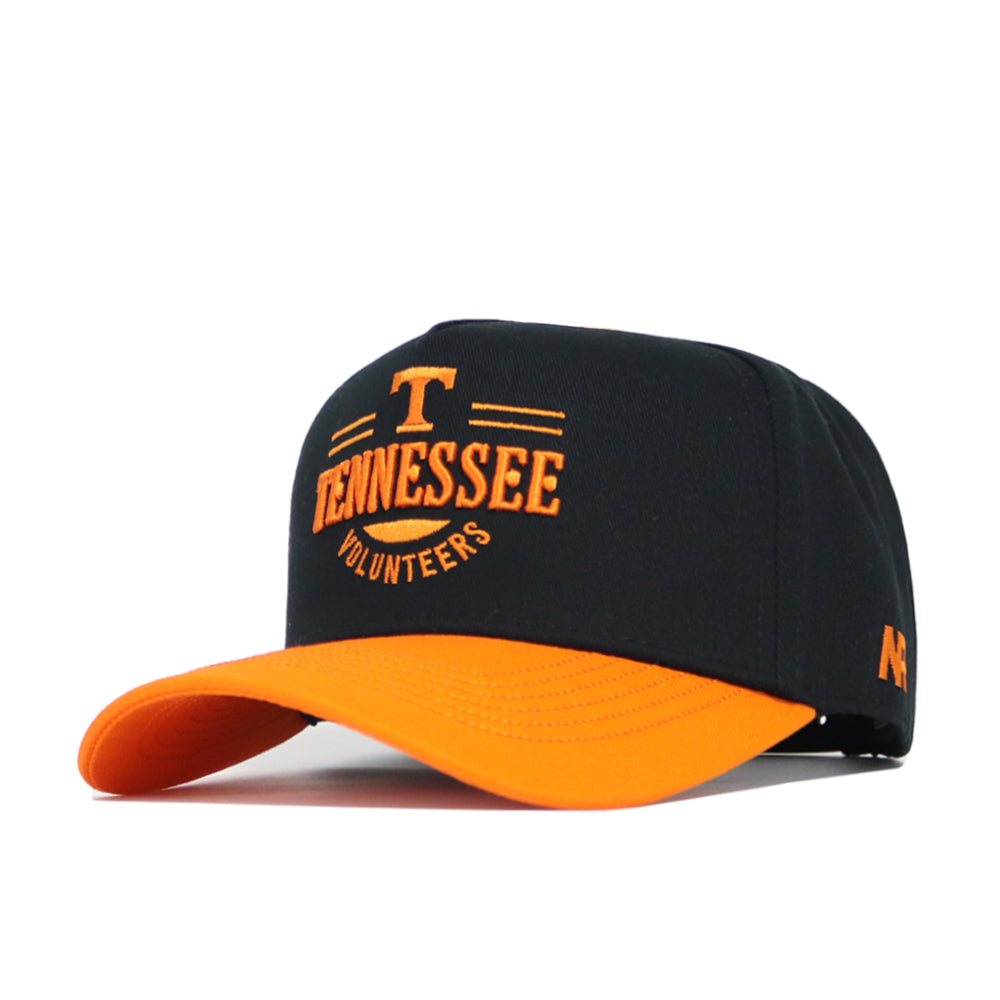 The Tennessee Tailgate Hat by No Rivals is a black snapback with an orange brim, featuring an embroidered orange T and Tennessee Volunteers on the front. Made from high-quality cotton for a comfortable, structured fit.