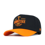 The Tennessee Tailgate Hat by No Rivals is a black snapback with an orange brim, featuring an embroidered orange T and Tennessee Volunteers on the front. Made from high-quality cotton for a comfortable, structured fit.