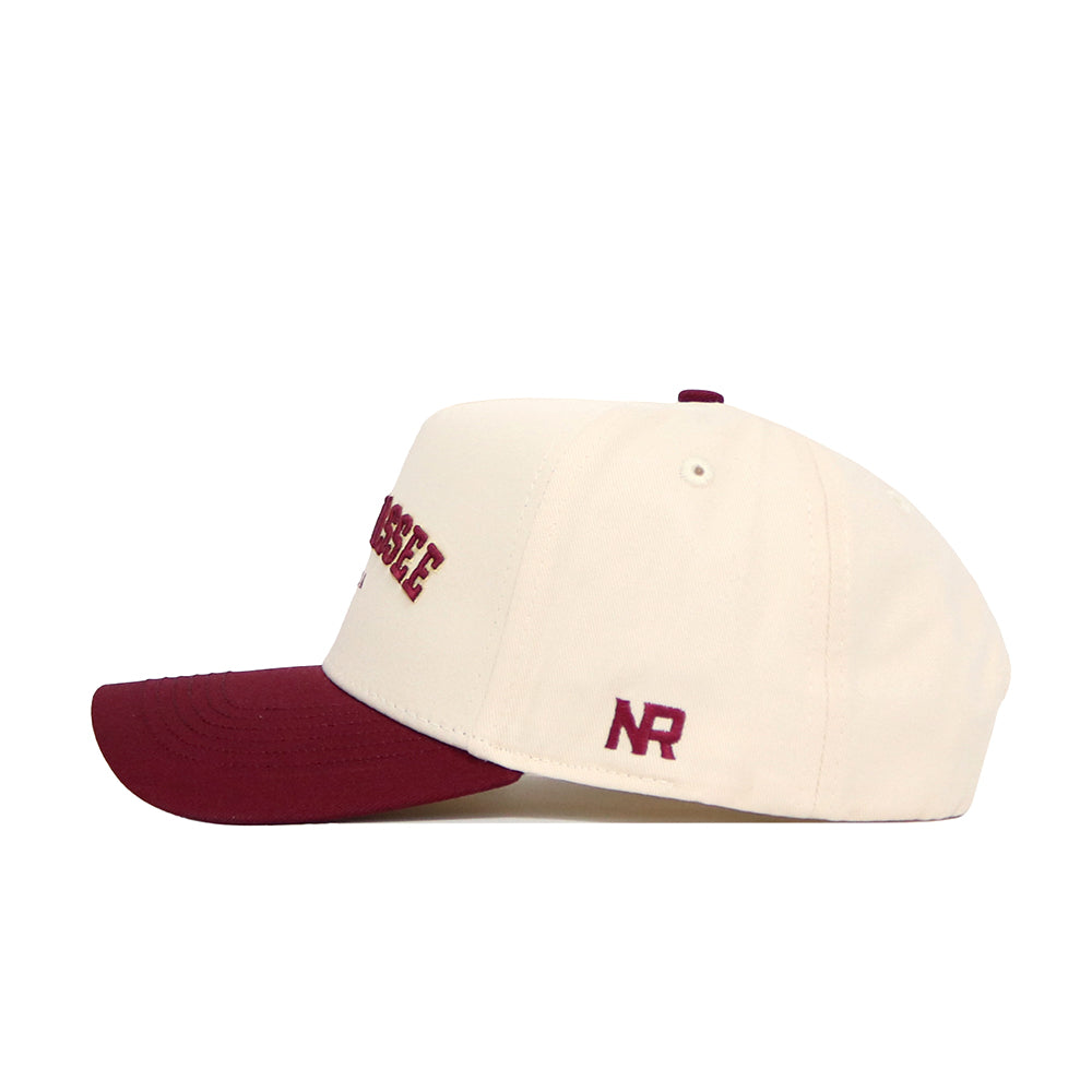 The No Rivals Tallahassee Hometown Hat is a cream cotton baseball cap with a maroon brim, maroon embroidered front text, "NR" stitched by the back, and a structured fit for comfort.