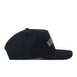 The UNT Night Mode Hat by No Rivals is a black snapback, shown in profile facing right, featuring partial white embroidered logos on the front.
