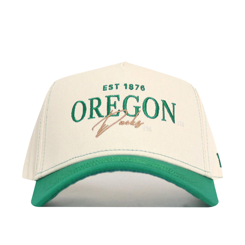 The No Rivals Oregon Vintage Hat is an officially licensed white and green snapback featuring an embroidered EST 1876 OREGON Ducks logo in green and gold on the front.