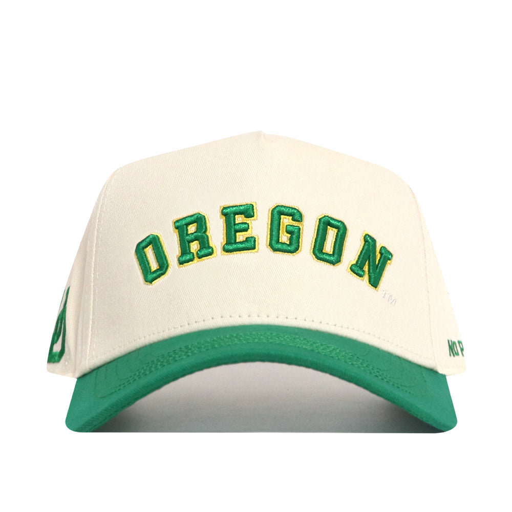 The Right Side Up Oregon Hat - Classic by No Rivals features a white snapback with a green brim and "OREGON" embroidered in green and yellow letters—an officially licensed cap perfect for showing your team spirit.