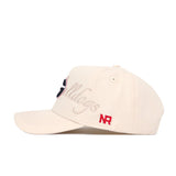The No Rivals Georgia Stacked Hat is a beige cotton cap with a structured fit, Bulldogs embroidered in cursive on the side, a red NR logo near the brim, eyelets on top, and a curved bill.