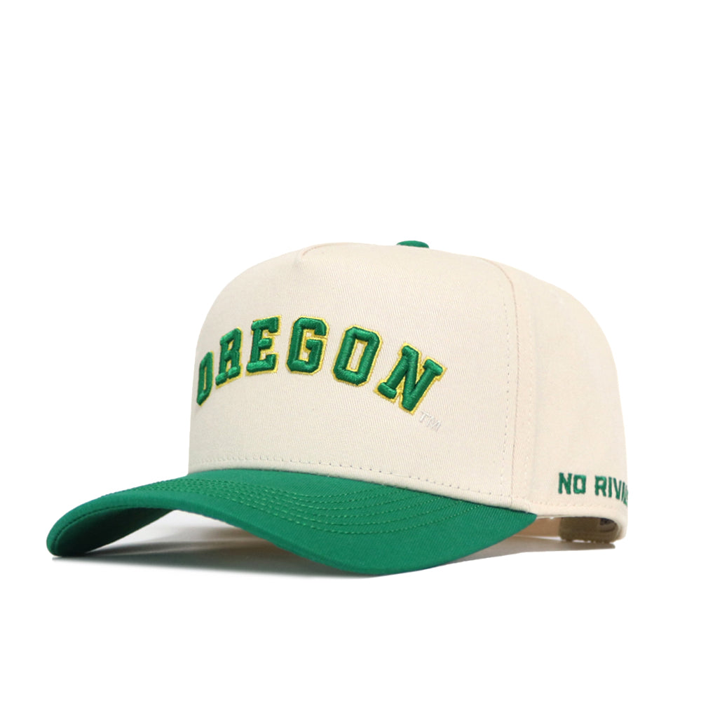 The Right Side Up Oregon Hat - Classic by No Rivals is a cream and green snapback cap featuring an embroidered green and yellow OREGON logo on the front—ideal for your gameday look.