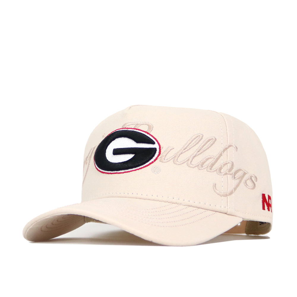 The No Rivals Georgia Stacked Hat is a beige snapback made from high quality cotton, featuring a large embroidered G logo in black, red, and white, "Bulldogs" script, and a small red N logo on the side.