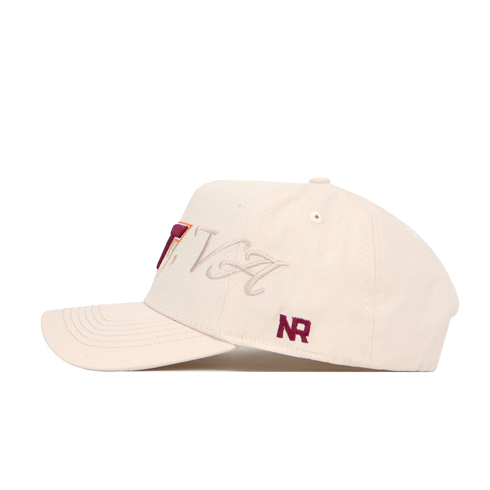The Virginia Tech Stacked Hat by No Rivals is a beige cotton baseball cap with maroon NR embroidery and stylized script on the side. It features a structured fit, curved brim, visible stitching, and an adjustable snapback closure.