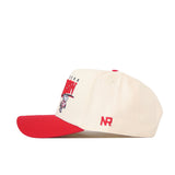 A cream-colored Wisconsin Badgers Stride Hat by No Rivals, this snapback baseball cap features a bold red brim and an embroidered design on the front. Crafted from high-quality cotton, it offers a structured fit with striking red NR lettering on the side.