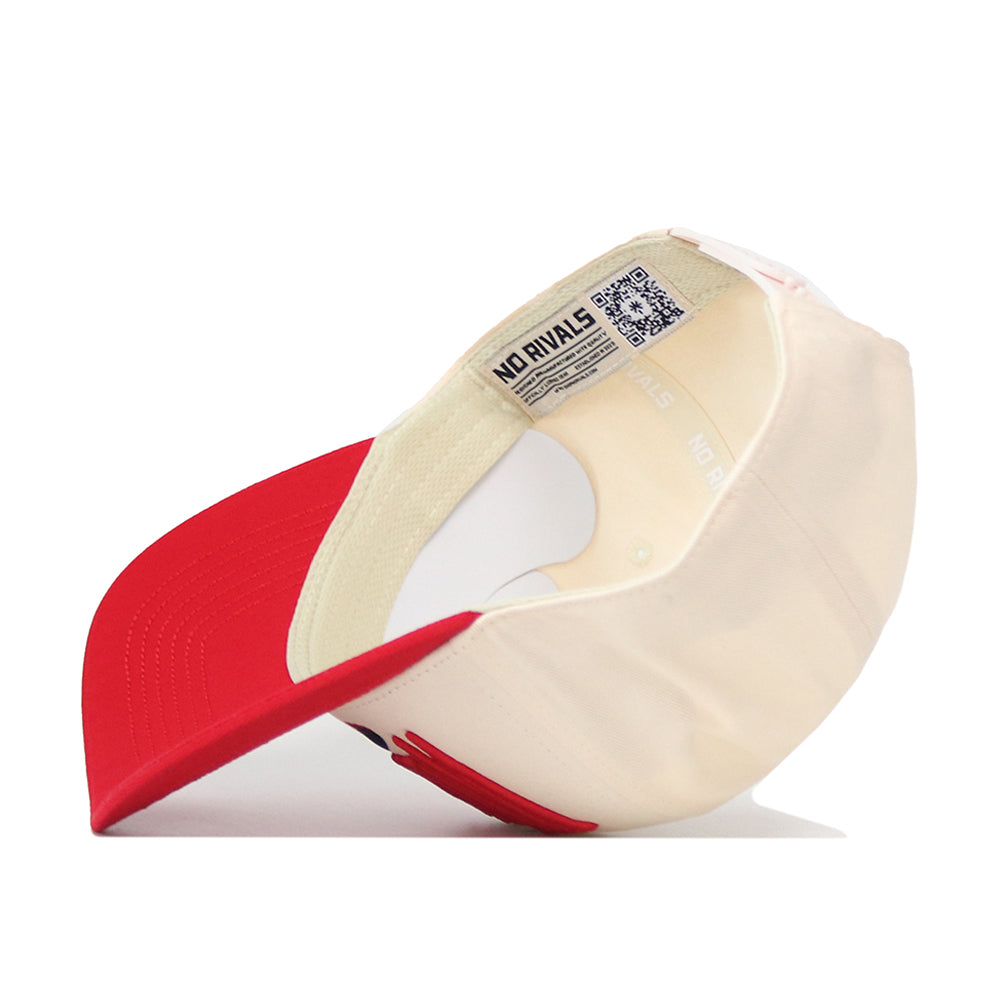 The No Rivals Wisconsin Badgers Stride Hat is displayed upside down, showcasing its inner lining, labels, and adjustable back strap. Made from high-quality cotton, this cream and red snapback features a comfortable and structured fit.