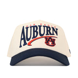 The No Rivals Auburn Tigers Stride Hat is a white baseball cap featuring the officially licensed War Eagle Auburn and Auburn University logo beautifully embroidered in blue and orange on the front, finished with a dark blue bill and a convenient snap back closure.