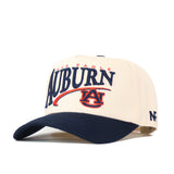 The No Rivals Auburn Tigers Stride Hat is a cream and navy snapback baseball cap, officially licensed and featuring embroidered Auburn and AU logos on the front, “War Eagle” above, and “NF” on the side for authentic team spirit.