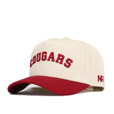 The Right Side Up Cougars Hat by No Rivals features a beige snapback design, red brim, "COUGARS" embroidered in red on the front, and "NR" stitched on the side—making it a perfect gameday fit for Washington State fans.
