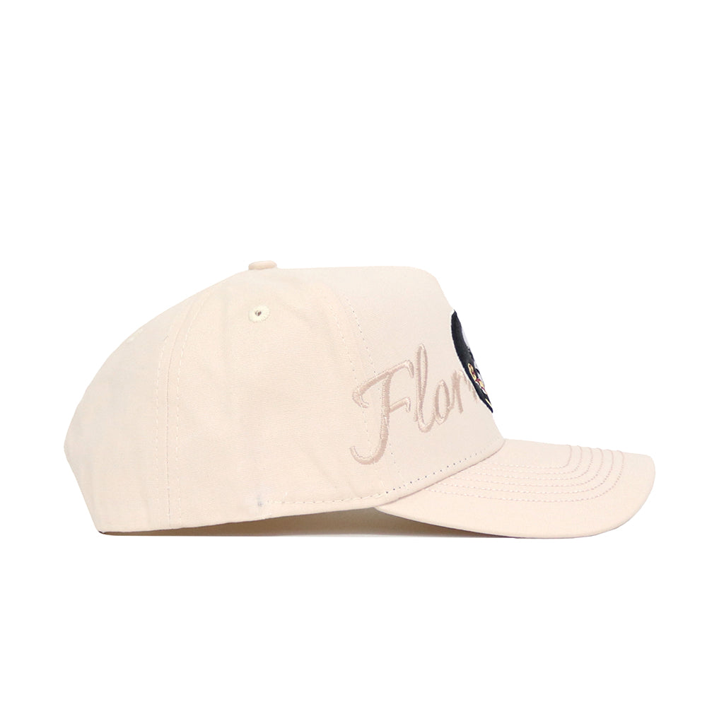 The Florida State Stacked Hat by No Rivals is a beige, structured cotton baseball cap, shown in side view. "Flor" is embroidered in cursive on the front panel with a partially visible design also featured on the front.