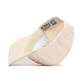 A light beige Clemson Stacked Hat by No Rivals is turned inside out, showing the inner lining, stitched seams, and a sweatband label with "NO RIVALS" plus a QR code.