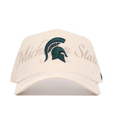 The Michigan State Stacked Hat by No Rivals is a beige snapback crafted from high-quality cotton, featuring the Michigan State Spartans logo and "Michigan State" embroidered in script on the front. Officially licensed.