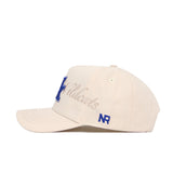 The Kentucky Stacked Hat by No Rivals is a beige snapback made from high-quality cotton, with blue embroidered "Wildcats" and a large N on the front, plus NR stitched in blue above the brim.