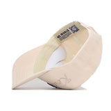 A light pink Kentucky Stacked Hat by No Rivals is shown inside out, revealing its inner label, QR code, stitching, headband, "RIVALS" printed on the tape, and a partially visible embroidered logo on the brim. Made from high quality cotton.
