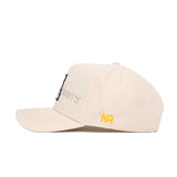 The App State Stacked Hat by No Rivals is a beige cotton cap with NR embroidered in yellow on the side and stacked cursive text on the front. It features a structured fit, curved brim, and visible stitching for a classic style.