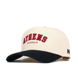 The Athens Hometown Hat by No Rivals is a cream snapback with a black brim, made from high quality cotton. It has "ATHENS" in large red letters, "GEORGIA" below, a small black logo on the side, and a structured fit.