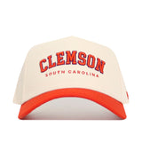 The No Rivals Clemson Hometown Hat is a white cotton snapback with an orange brim, featuring "Clemson" in bold orange letters and "South Carolina" below, designed for a structured fit and lasting style.