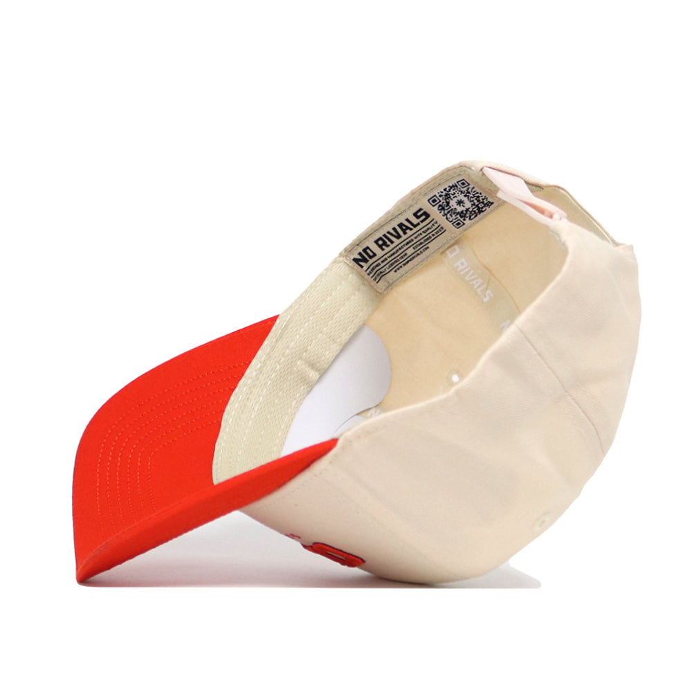 The Clemson Hometown Hat by No Rivals is shown upside down, revealing the inside label with "NO RIVALS" text and a QR code under the brim. Made from cotton, this beige and red snapback has an adjustable strap at the back.