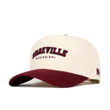 The No Rivals Starkville Hometown Hat is a cream snapback with a maroon brim, high-quality cotton, and structured fit. "STARKVILLE" and "MISSISSIPPI" are embroidered on the front, plus an "A" on the side.