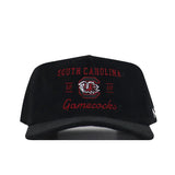 The South Carolina Vintage Cord Hat - Black features a black corduroy design, an embroidered Gamecocks logo with “South Carolina Gamecocks 1801” in red and white on the front, and an unstructured fit for all-day comfort.