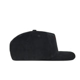 The South Carolina Vintage Cord Hat in black, featuring an unstructured fit, is displayed in side profile against a white background.