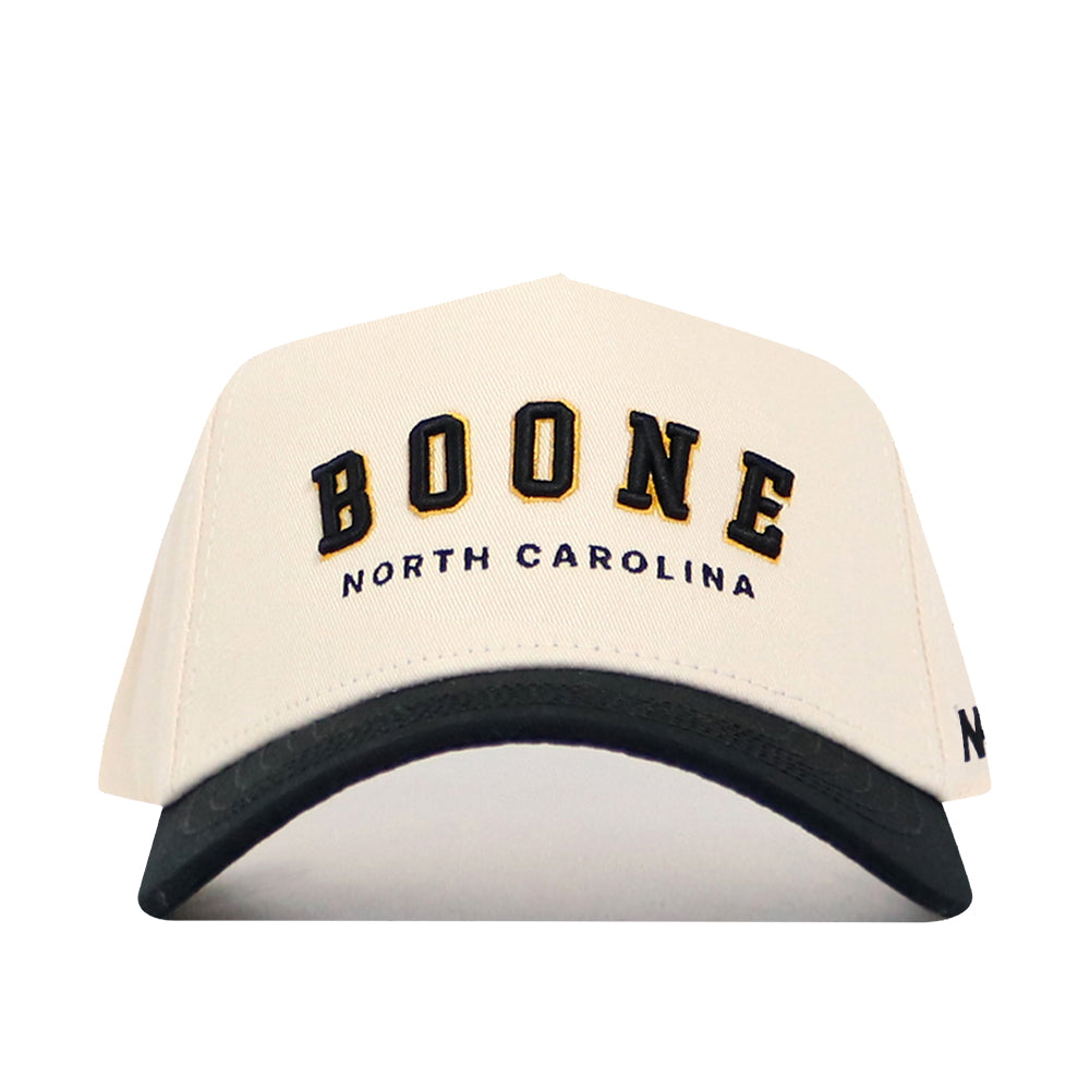 The Boone Hometown Hat by No Rivals is a white structured baseball cap with a black curved brim, BOONE in bold black and yellow letters, NORTH CAROLINA below, and an adjustable snapback for comfort.