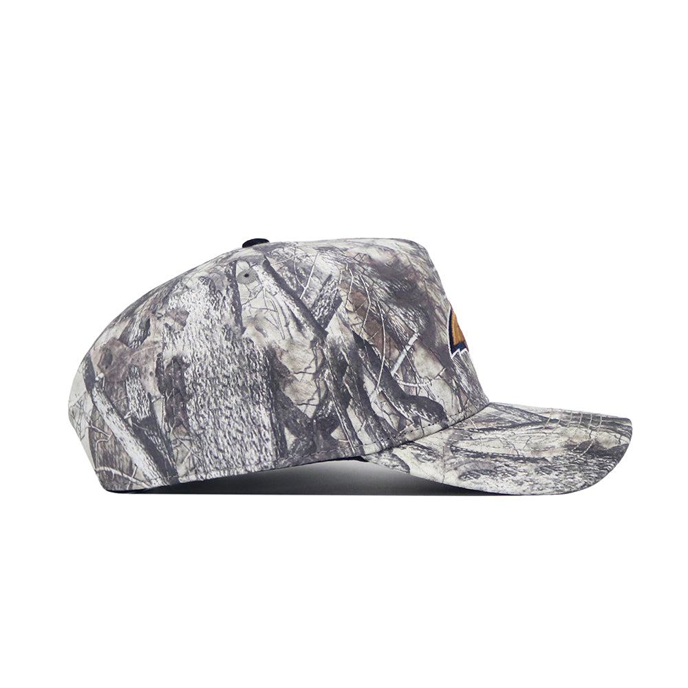 Side view of the No Rivals Montana State Outland Hat, an adjustable cotton cap featuring a gray and brown camouflage pattern and a curved brim.