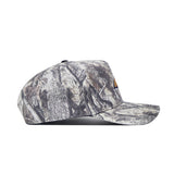 Side view of the No Rivals Montana State Outland Hat, an adjustable cotton cap featuring a gray and brown camouflage pattern and a curved brim.