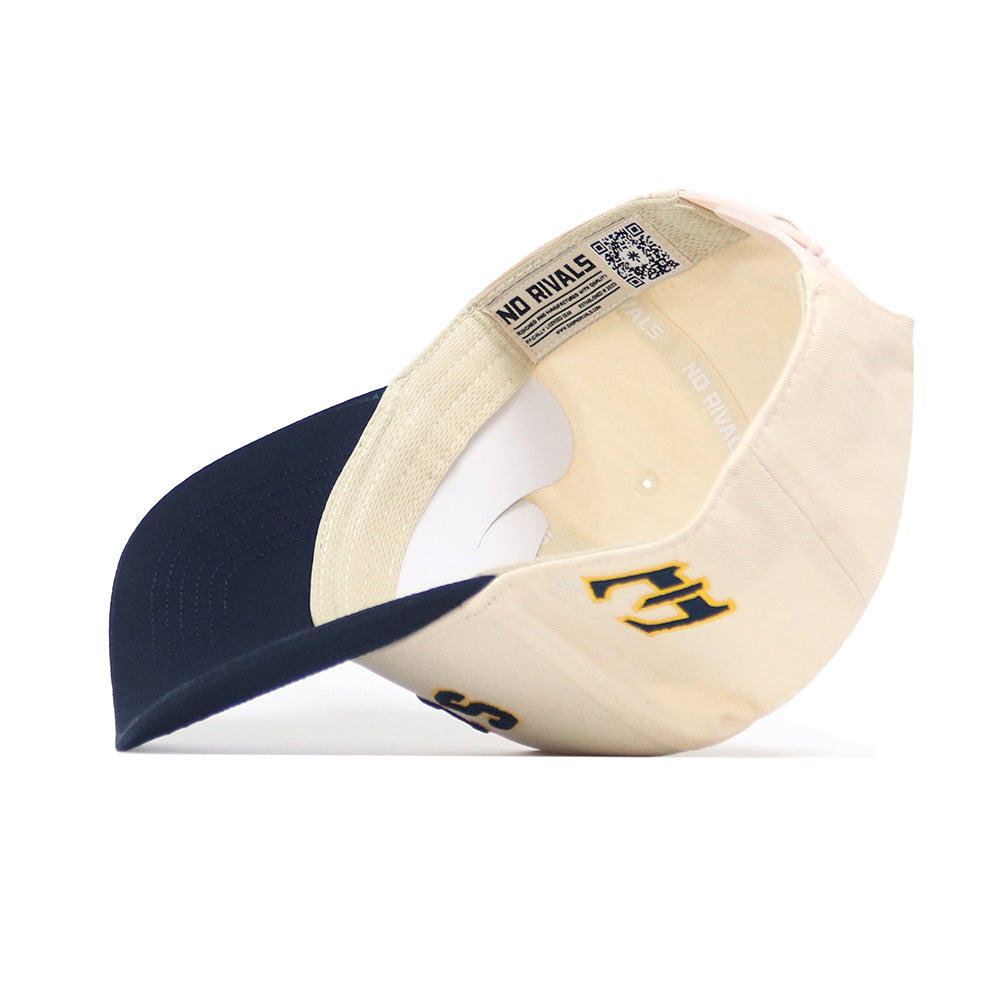 The No Rivals Upside Down BUCS Hat - ETSU - Classic Colors is a beige and navy baseball cap shown from underneath, with a curved brim, interior labels, QR code, and yellow/navy embroidered N and R inside. Made of quality cotton for structure.