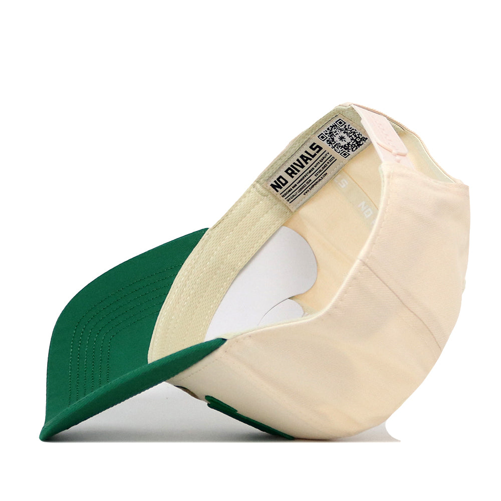 Side view of a cream-colored USF Stride Hat with a dark green brim and embroidered logos, showcasing the interior label as part of a stylish gameday fit.