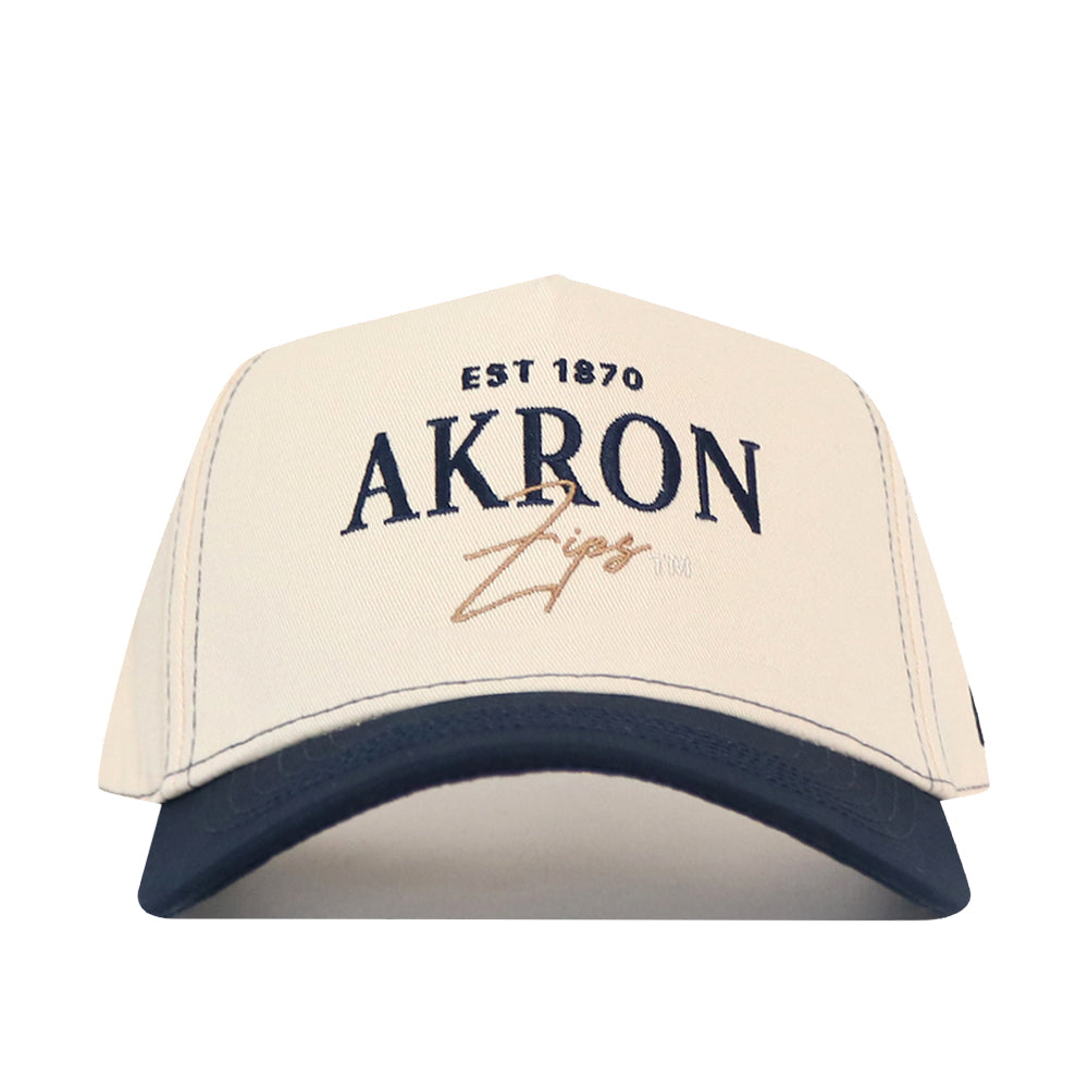 Off-white No Rivals Akron Zips Vintage Hat with a navy blue brim, featuring an embroidered logo of EST 1870 and AKRON Zips on the front.