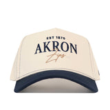 Off-white No Rivals Akron Zips Vintage Hat with a navy blue brim, featuring an embroidered logo of EST 1870 and AKRON Zips on the front.